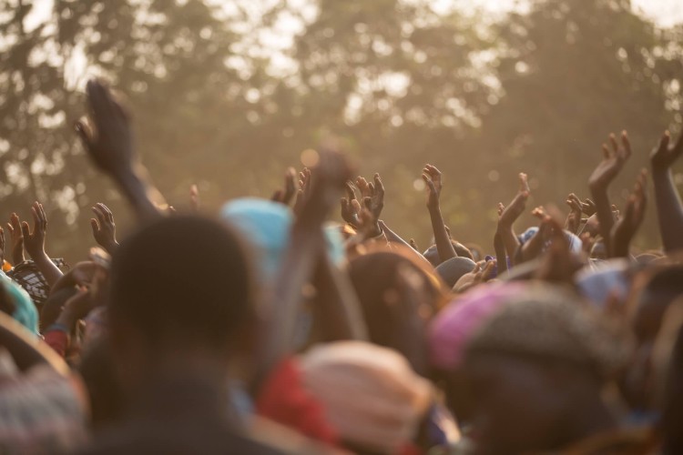Hands Raised in a Crowd